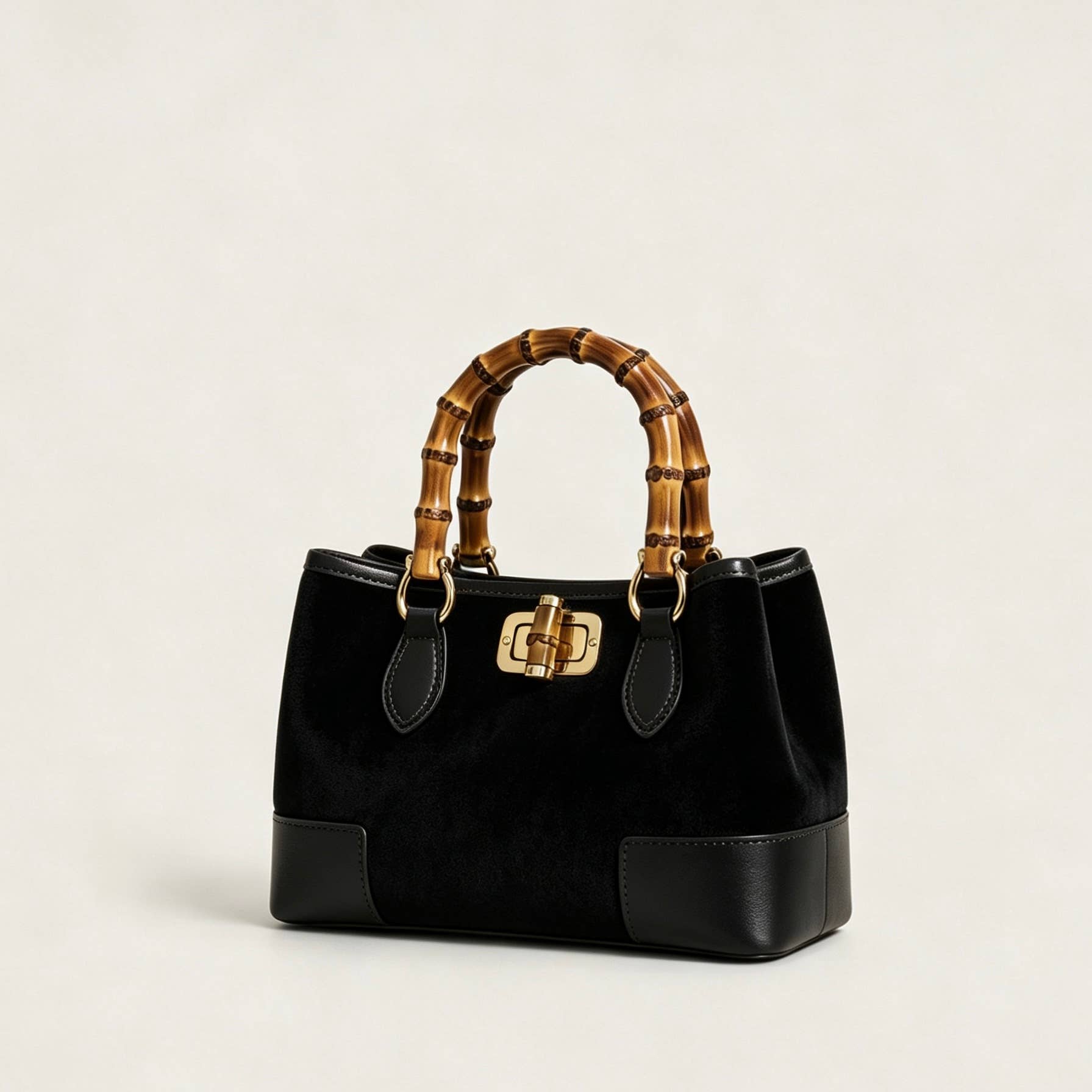 THE C.J. SUEDE BAMBOO TOP HANDLE BAG