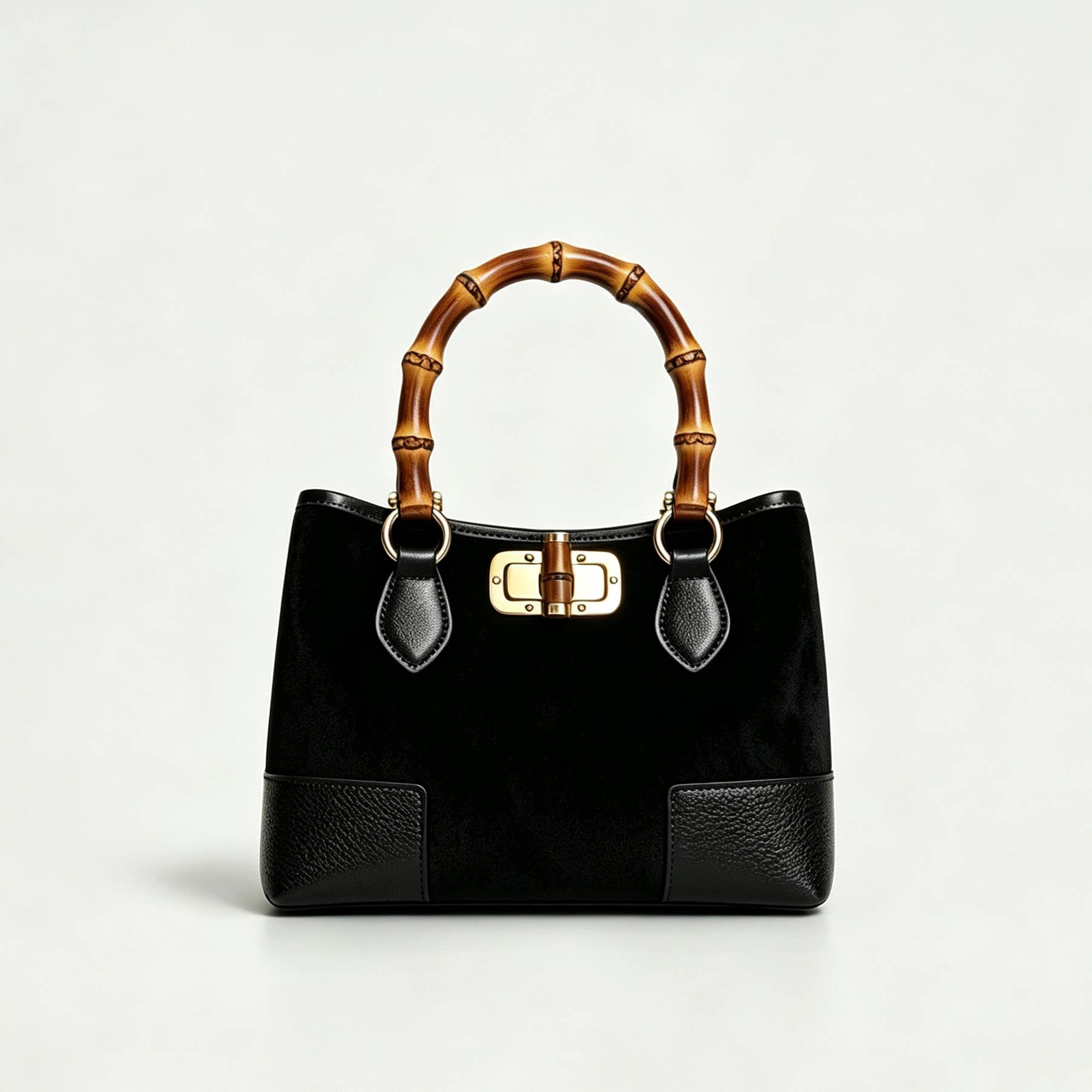 THE C.J. SUEDE BAMBOO TOP HANDLE BAG